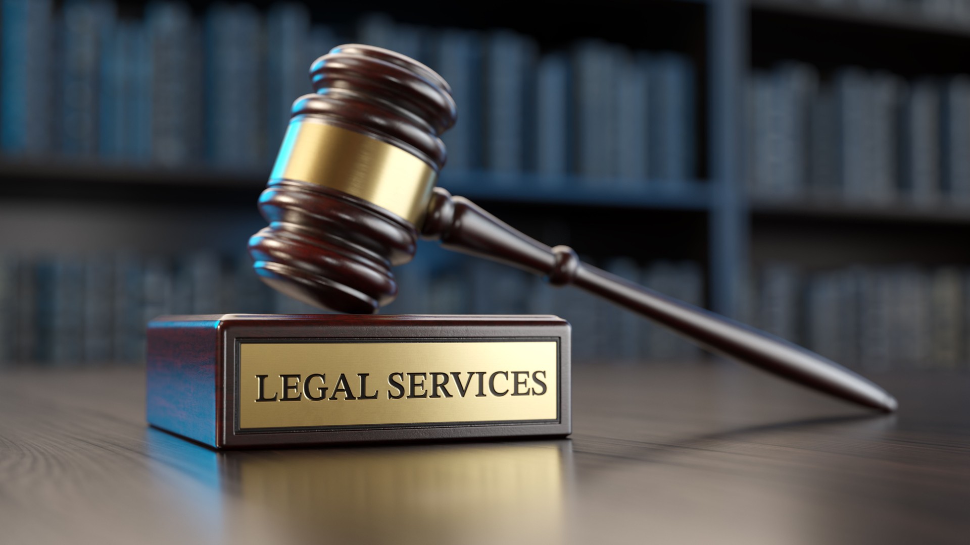 Legal Services: Judge's Gavel as a symbol of legal system and wooden stand with text word on the background of books